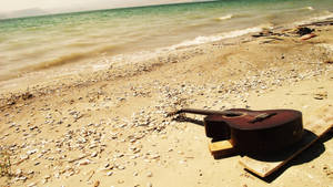 Sunny Beach Vibes With A Guitar Wallpaper