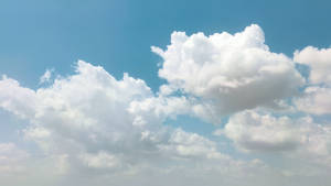 Sunny Bright Blue Cloudy Sky Wallpaper