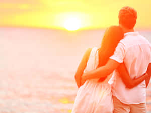 Sunset Couple Beach Wallpaper