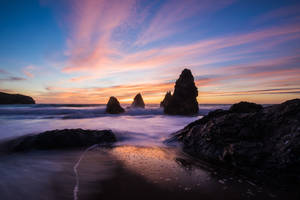 Sunset Ocean Rocks By Shore Wallpaper