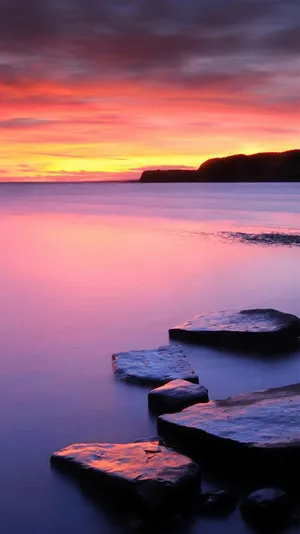 Sunset Serenityat Sea Wallpaper
