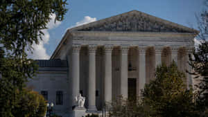 Supreme Court Building Surrounded By Trees Wallpaper