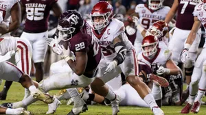 Tackling College Football Players Wallpaper