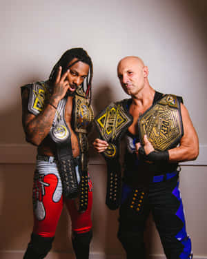 Tag Team Champions Pose With Belts Wallpaper