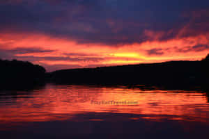 Take A Break And Explore The Beauty Of A Mountain Lake. Wallpaper