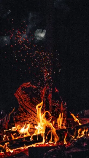 Take A Moment And Warm Yourself In The Flames Wallpaper