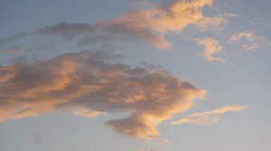 Take A Moment To Enjoy The Serene Aesthetic Of A Sunset Sky Wallpaper