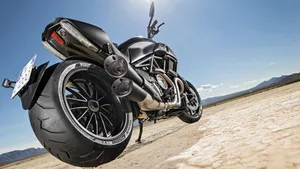Take The Road In Style - Diablo Rosso On A Motorbike Wallpaper
