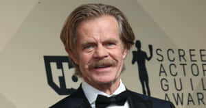 Talented Actor William H. Macy Looking Pensively Into The Distance Wallpaper