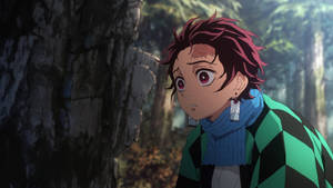 Tanjiro Bravely Ventures Into A Dark Forest On His Mission To Become A Demon Slayer Wallpaper