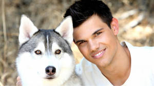 Taylor Lautner With Husky Wallpaper