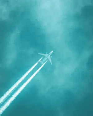 Teal Sky And Airplane Wallpaper