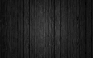 Tech Style - Black Mac On Wooden Table Wallpaper