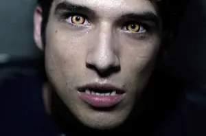 Teen Wolf Star, Tyler Posey Looking Thoughtful In An Outdoor Scene Wallpaper