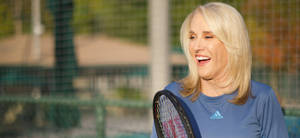 Tennis Legend Tracy Austin Poised With Tennis Racket Wallpaper