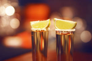 Tequila Glasses Topped With Lemon Wallpaper