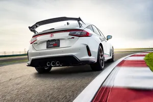 The 2019 Honda Civic Type R Is Driving On A Race Track Wallpaper