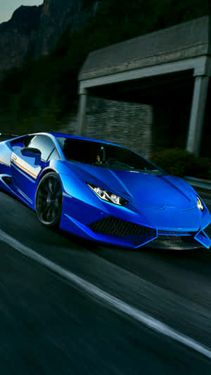 The Blue Lamborghini Drive Giving The Thrill Of Luxury Wallpaper