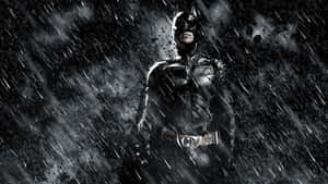 The Dark Knight Stands At The Center Of A Post-apocalyptic Landscape Wallpaper