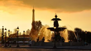 The Eiffel Tower Stands Over The City Of Lights Wallpaper