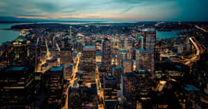 The Emerald City Glows: Seattle At Night Wallpaper