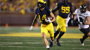 The Energetic Player Of University Of Michigan-ann Arbor Wallpaper