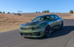 The Green 2019 Dodge Charger Srt Driving On A Race Track Wallpaper