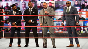The Hurt Business With Cedric Alexander In Boxing Ring Wallpaper