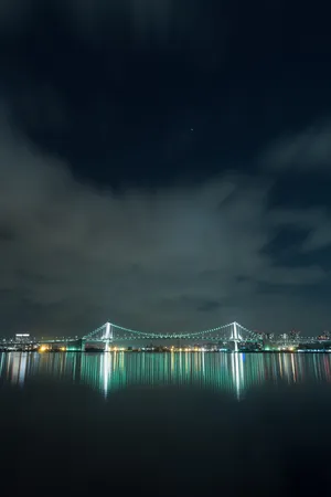 The Iconic Rainbow Bridge In Tokyo, Japan Wallpaper