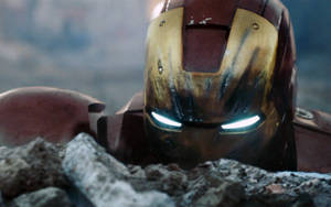 The Iron Man Mark 3 Helmet Showcasing Its Signature Gold Arc Reactor Wallpaper