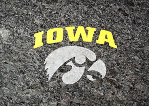 The Irresistible Strength Of The Iowa Hawkeyes Captured In A Striking Image. Wallpaper