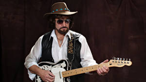 The Legendary Waylon Jennings Wearing Sunglasses Wallpaper