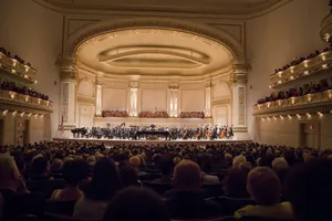 The Majestic Carnegie Hall Illuminated At Night Wallpaper