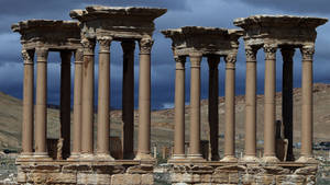 The Majestic Tetrapylon Monument In Palmyra Wallpaper