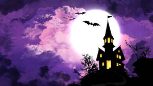 The Moon Casts A Ghostly Pall Over A Haunted House On Halloween Night. Wallpaper