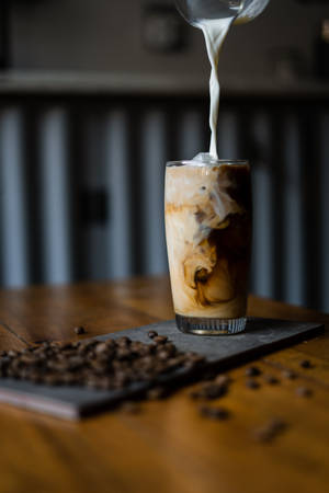 The Perfect Combination Of Creamy Milk And Rich Coffee. Wallpaper