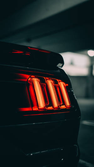 The Red And Black Contrast Of A Tail Light Wallpaper