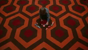 The Shining Danny Playing On Carpet Wallpaper