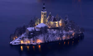 The Snowed Island In Lake Bled At Night Wallpaper