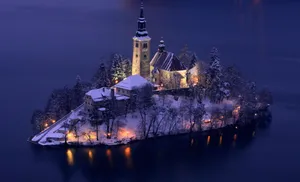 The Snowed Island In Lake Bled At Night Wallpaper