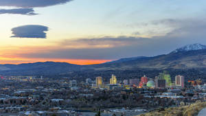 The Stunning View Of Reno's Skyline At Sunset. Wallpaper