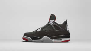 The Timeless Air Jordan 4 Shoes In White, Black And Evergreen Wallpaper