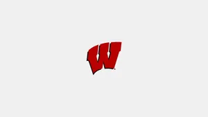 The Wisconsin Badgers Football Team In Action On The Field Wallpaper