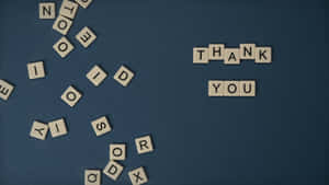 The Word 'gratitude' Spelled Out With Scrabble Tiles Wallpaper