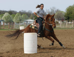 Thrilling Barrel Racing Action Wallpaper