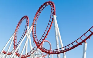 Thrilling Double Loop Roller Coaster Ride Wallpaper