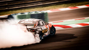 Thrilling Drift Car In Action Wallpaper