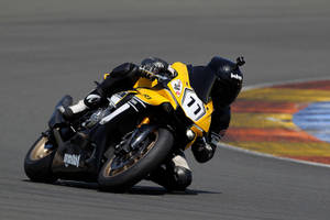 Thrilling Momentum In Motorcycle Racing Wallpaper