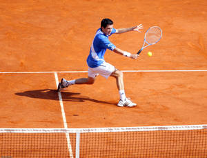 Tim Henman Fiercely Competing On A Clay Court Wallpaper