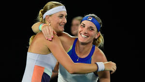 Timea Babos And Kristina Mladenovic In Action Wallpaper